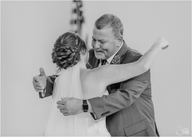 emotional father of the bride hugs daughter before Wildwood wedding