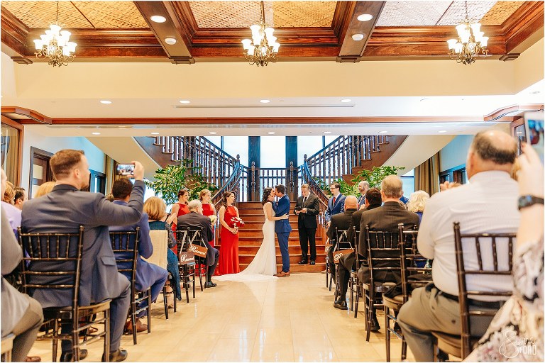 bride & groom share first kiss as husband & wife at waterfront wedding ceremony