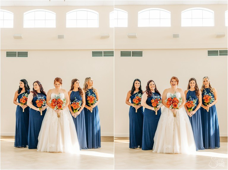 bride laughs with her bridesmaids in navy bridesmaid dresses and orange bouquets before Wildwood wedding
