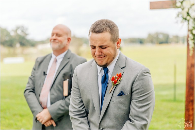 groom gets emotional as his bride starts to come down the aisle at Wildwood wedding