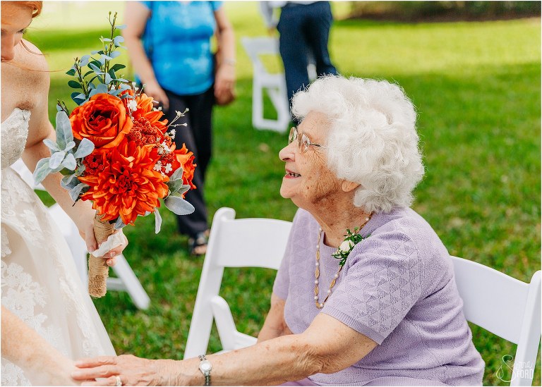 grandmother beams as she takes bride's hand after Wildwood wedding