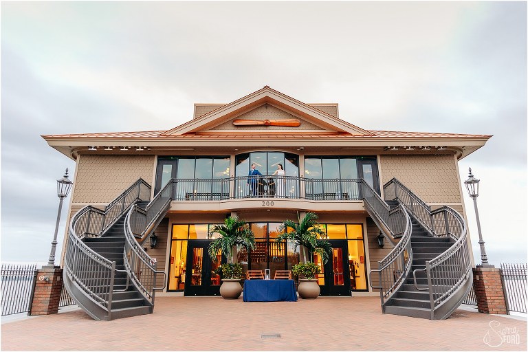 bride & groom hang out on balcony at Tavares Pavilion waterfront wedding