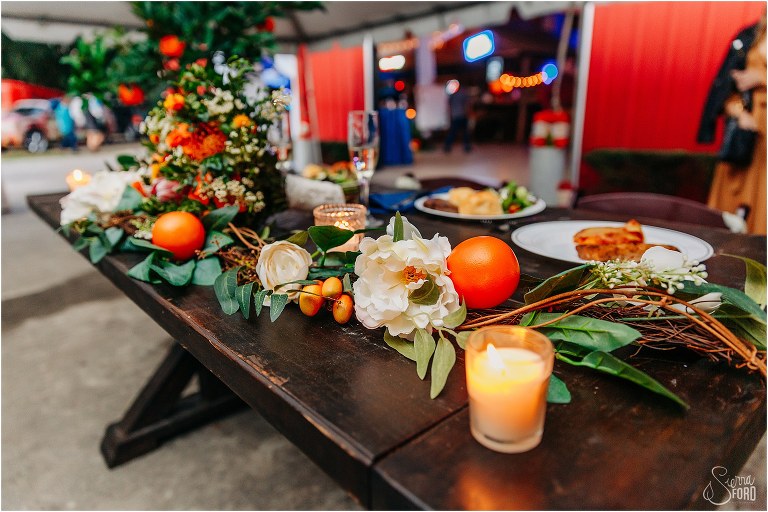 sweetheart table with white flowers and citrus accents at Horsepower Ranch wedding