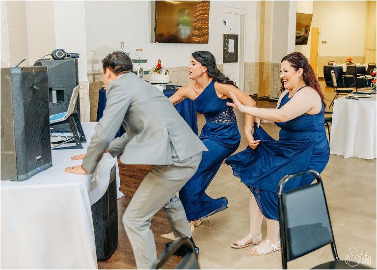 guests race to DJ table to guess song in order to eat dinner at Wildwood wedding