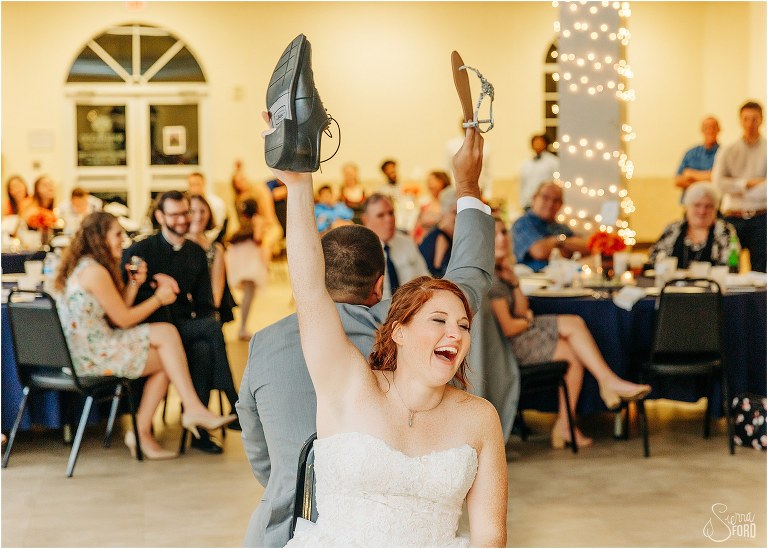 bride laughs at opposing answers during the shoe game at Wildwood wedding