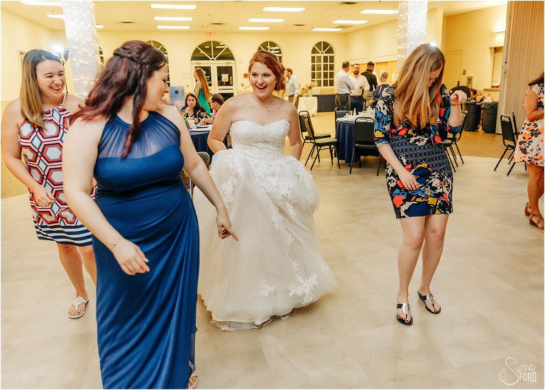 bride dances with her bridesmaids and guests at Wildwood wedding reception