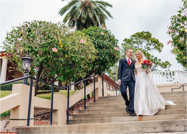 bride & groom stroll down staircase together at Mission Inn Resort wedding