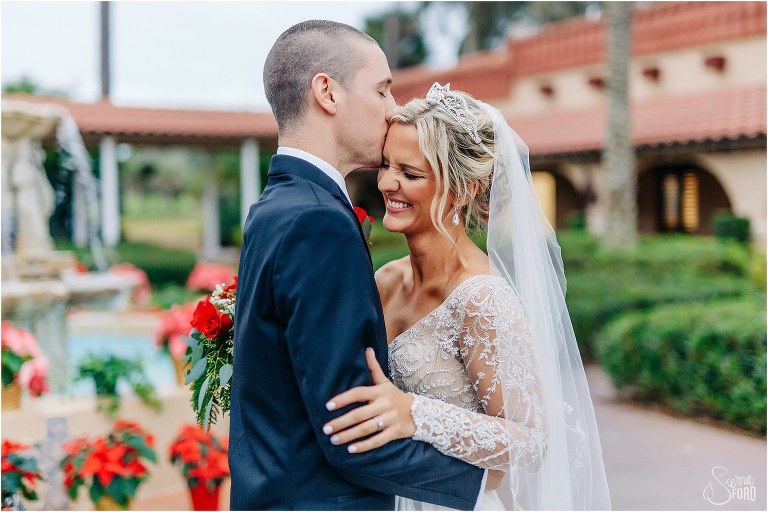 bride giggles as groom kisses her forehead at Mission Inn Resort wedding