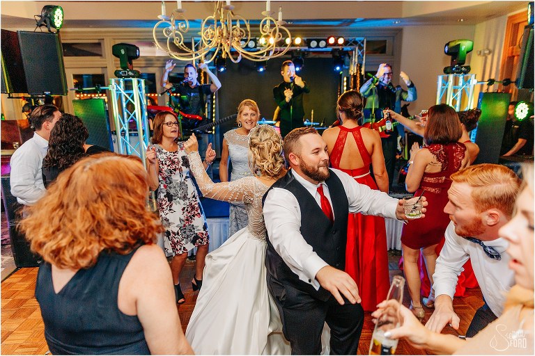 guests dance the night away with bride to NoFilter Band's music at Mission Inn Resort wedding