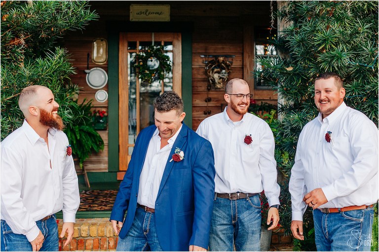 groom laughs with his groomsmen before Isola Farms wedding