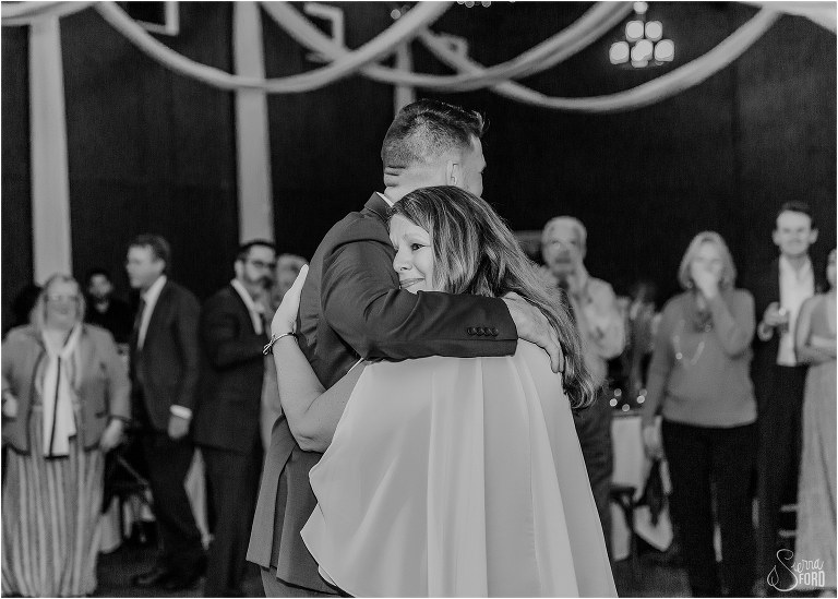 groom's mother gets emotional as she dances with son at Ever After Farms wedding