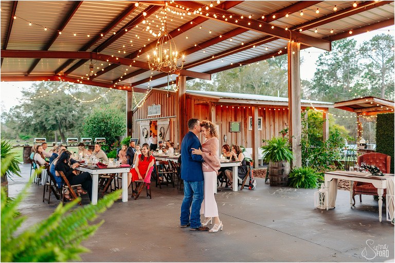 groom kisses mom's forehead as they share dance together at Isola Farms wedding