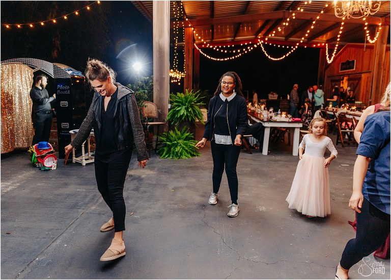 DJ and photographer take to the dance floor for the Wobble at Isola Farms wedding