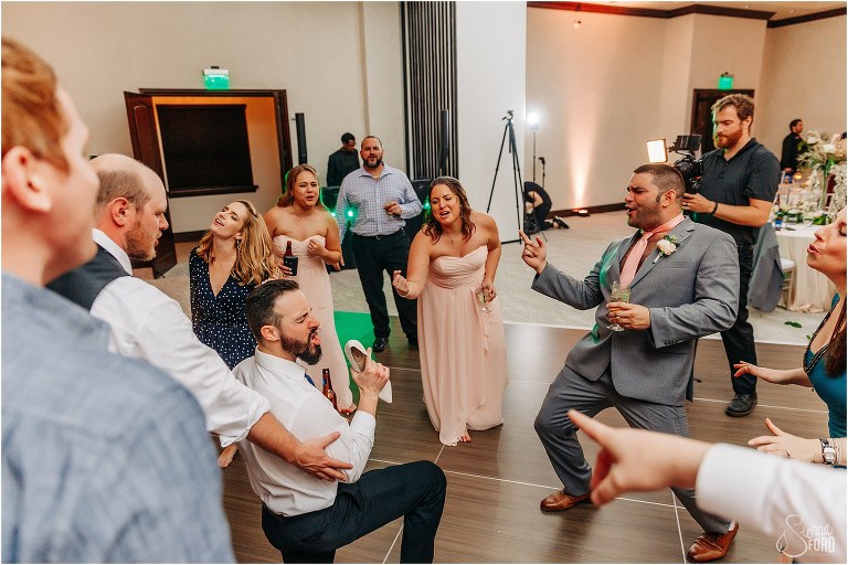 guests belt their faces off to favorite song on dance floor at Bella Collina wedding
