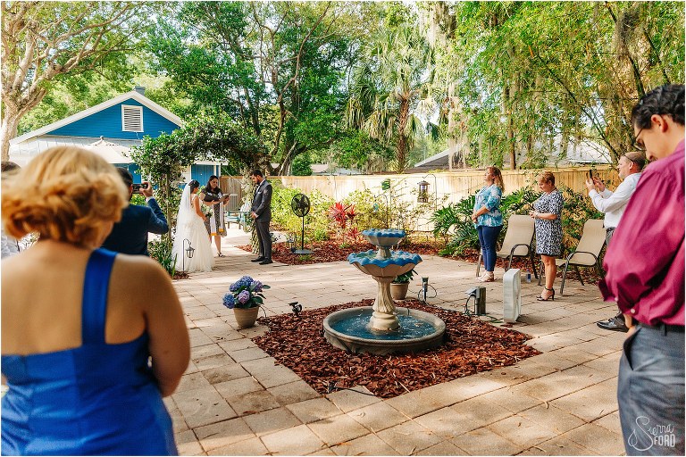 immediate friends and family watch Mount Dora tiny wedding ceremony while social distancing