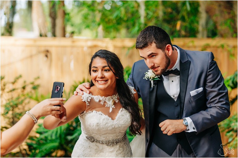 bride and groom say hi to guests attending Mount Dora tiny wedding virtually