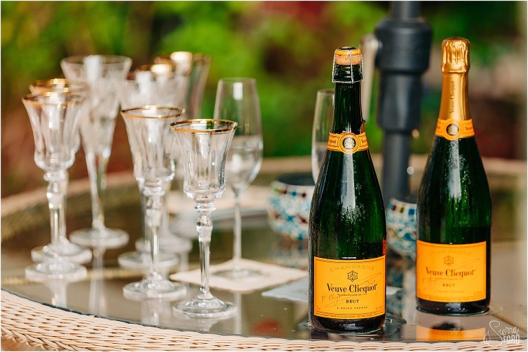 Mismatched flutes sit waiting for the celebratory champagne to be popped after Mount Dora tiny wedding ceremony