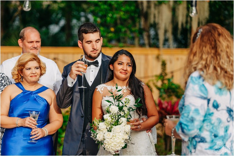 bride begins to tear up as her new mother-in-law gives toast at Mount Dora tiny wedding