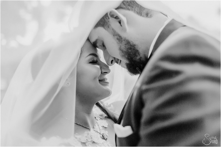 bride and groom give Eskimo kisses under bride's veil at Mount Dora tiny wedding
