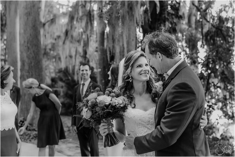 the newlyweds share a moment together surrounded by their loved ones at Kraft Azalea park wedding