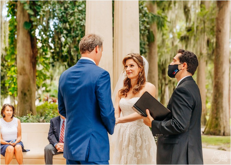 bride looks lovingly at groom as they exchange vows at Kraft Azalea park wedding