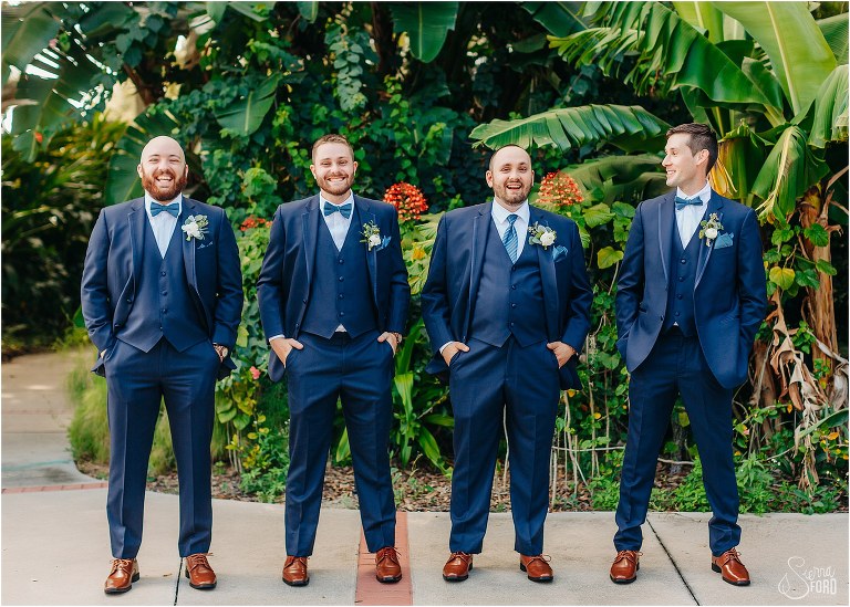 groom & groomsmen laugh together in Wooten Park before Tavares Pavilion wedding