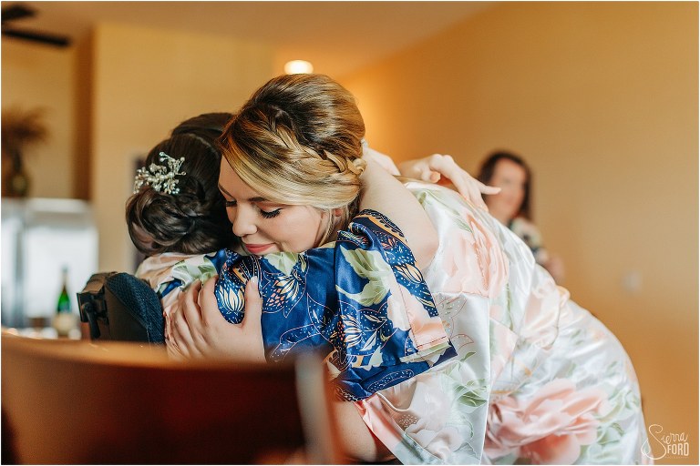 bride gives younger sister huge hug before Tavares Pavilion wedding