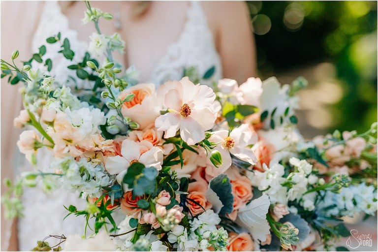 Closeup of blush and green bridal bouquet by BaugHaus florals at Tavares Pavilion wedding