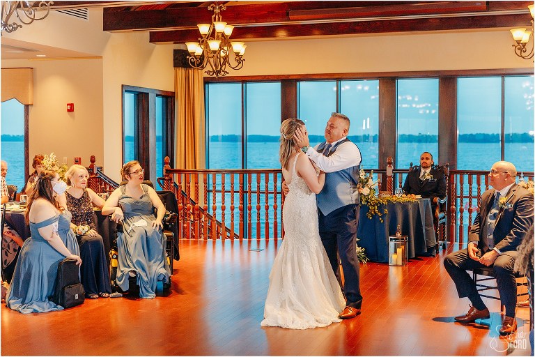 father wipes tear from daughter's eye as they share father/daughter dance at Tavares Pavilion wedding