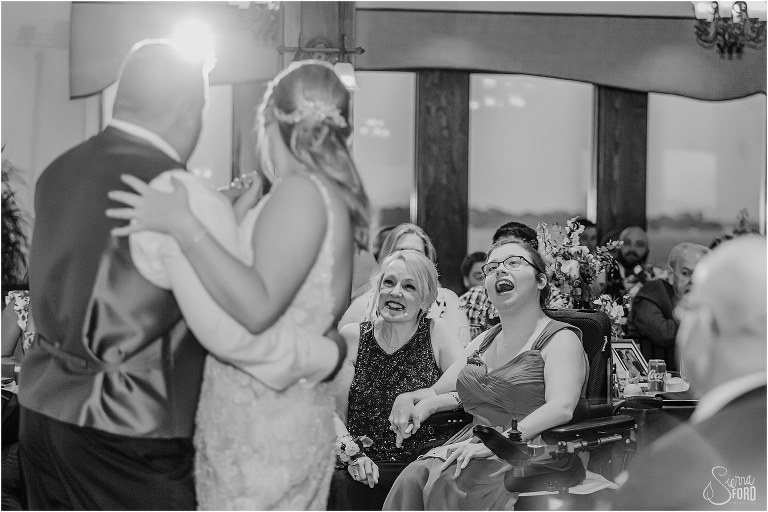 bride's mom and sister beam as they watch bride dance with father at Tavares Pavilion wedding