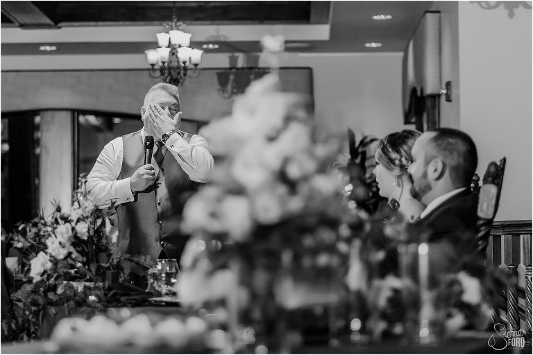 father of the bride wipes tears away during emotional toast at Tavares Pavilion wedding