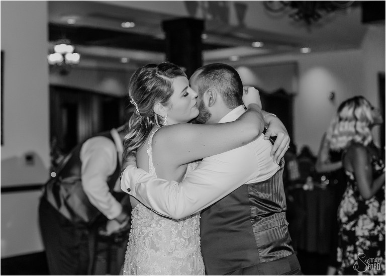 bride and groom share emotional slow dance together at end of Tavares Pavilion wedding