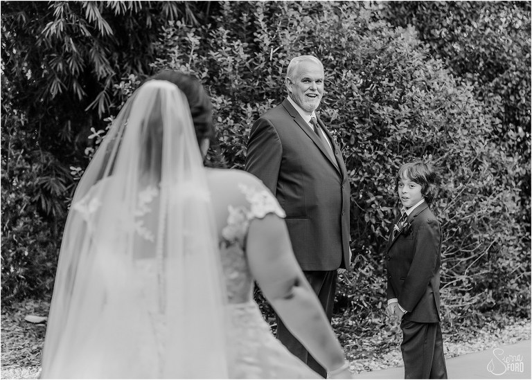 father and son of bride have emotional response to seeing bride for first time before rustic Apopka wedding