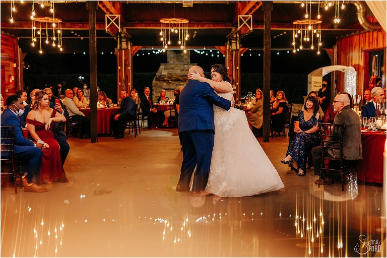 chandelier reflection as bride and groom share first dance at Apopka wedding venue