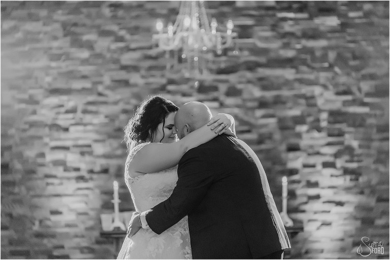 bride and groom dance forehead to forehead during emotional last dance