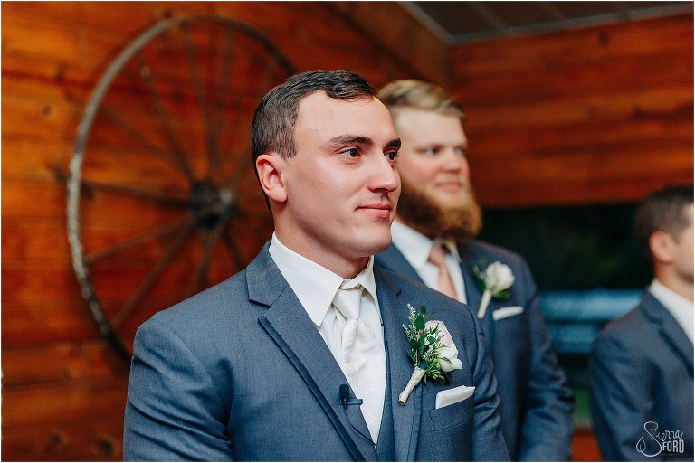 groom gets emotional as bride comes down aisle at Hidden Barn wedding