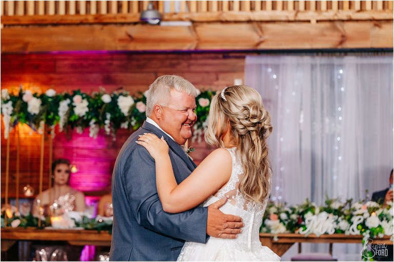 father beams at his daughter while they dance at Hidden Barn wedding