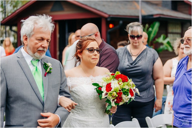 bride tears up as father walks her down the aisle at The Acre Orlando wedding