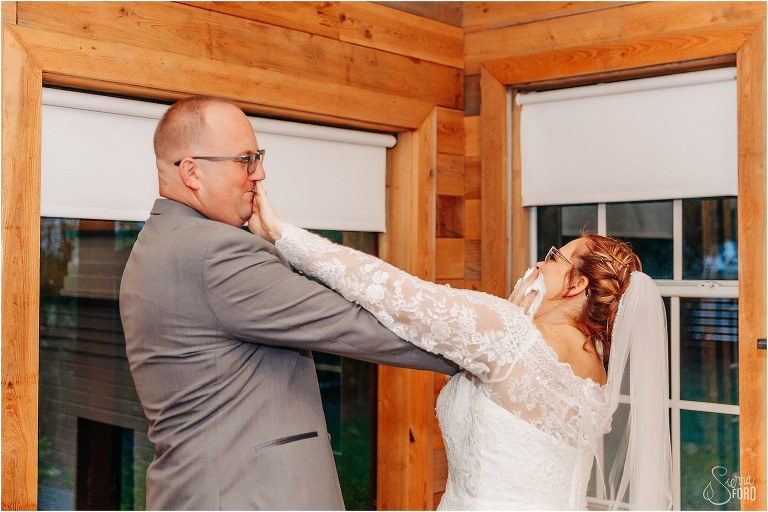 groom gets first crack at shoving icing in bride's face at The Acre Orlando wedding