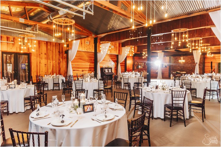 reception hall at rustic Apopka wedding with white tablecloths