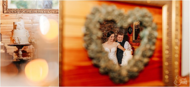 bride and groom cutting the cake reflected in heart mirror at rustic Apopka wedding