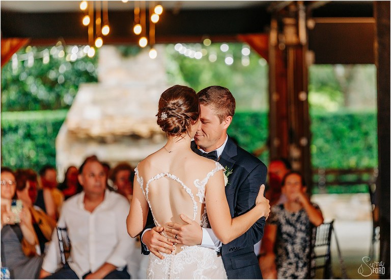 groom nuzzles bride as they share first dance at rustic Apopka wedding