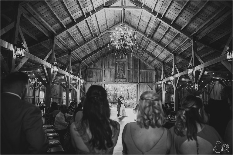 bride and groom share first dance under chandelier at Bridle Oaks wedding