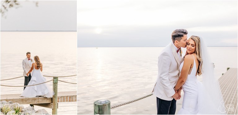 groom kisses bride on cheek gently by the water at Bayfront Lodge wedding