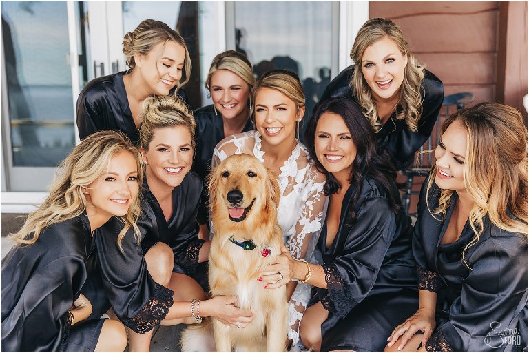 bridesmaids snuggle up to bride & her golden retriever before Bayfront Lodge wedding