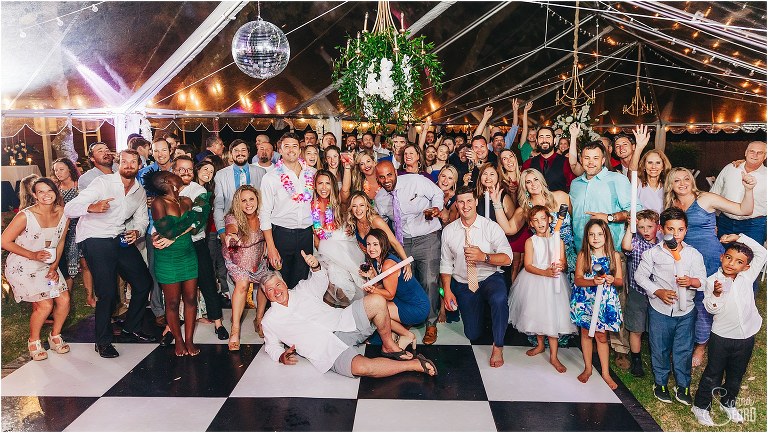 huge group photo of all the guests with bride and groom at Bayfront Lodge wedding