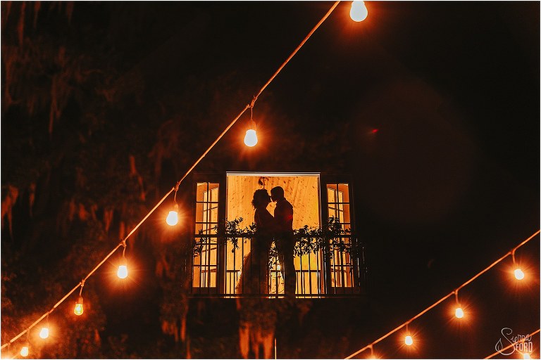 double exposure of market lights and couple silhouetted in window at October Oaks wedding