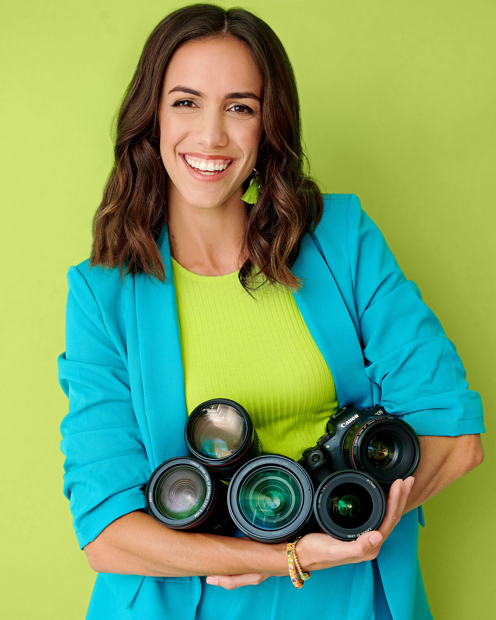 Sierra, Orlando branding photographer posing with lenses